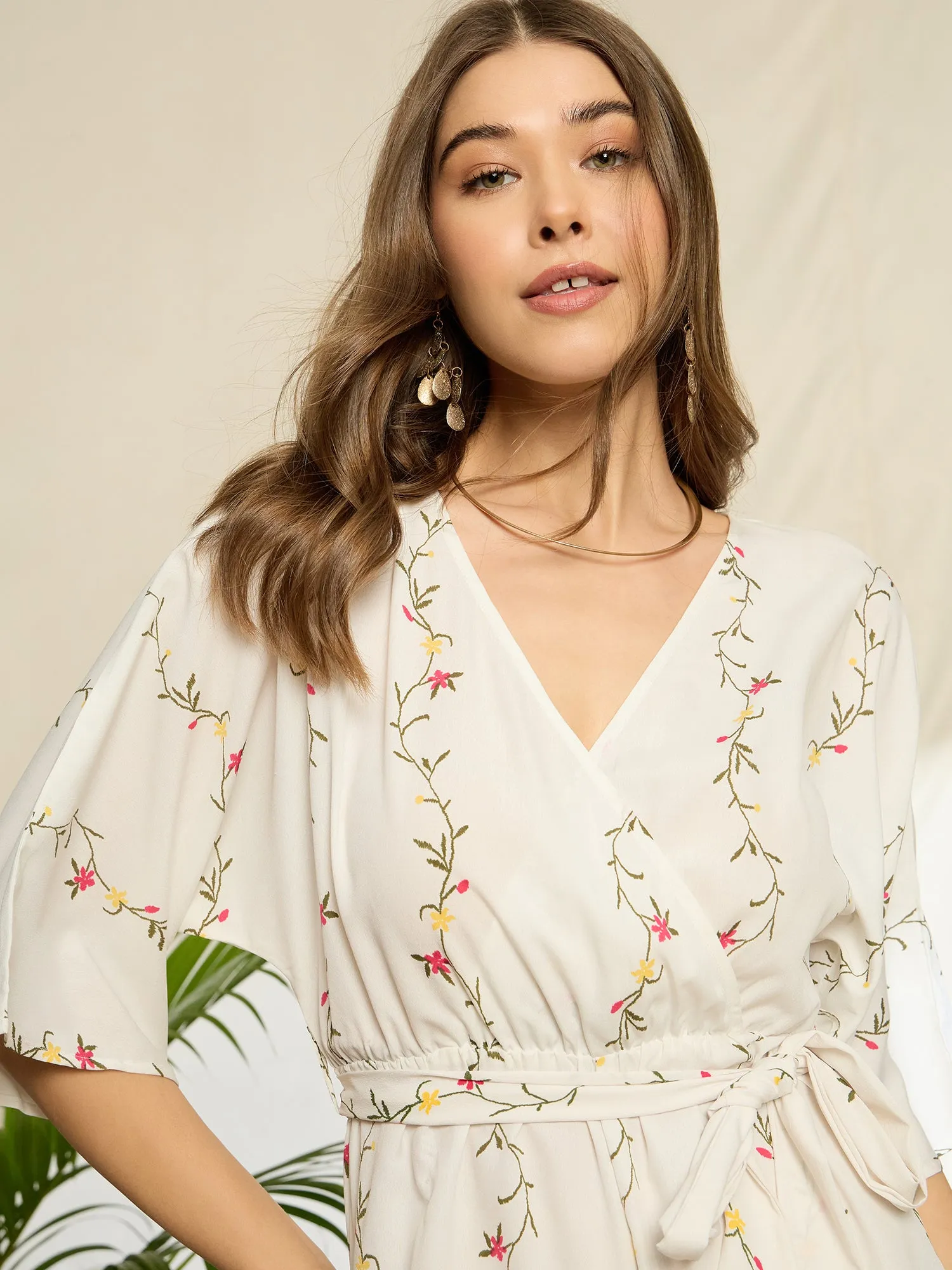 Berrylush Women White Floral Printed V-Neck Three-Quarter Sleeves Waist Tie-Up Wrap Mini Jumpsuit