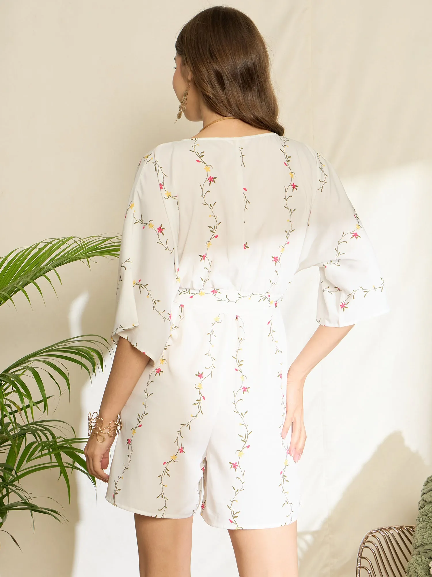 Berrylush Women White Floral Printed V-Neck Three-Quarter Sleeves Waist Tie-Up Wrap Mini Jumpsuit