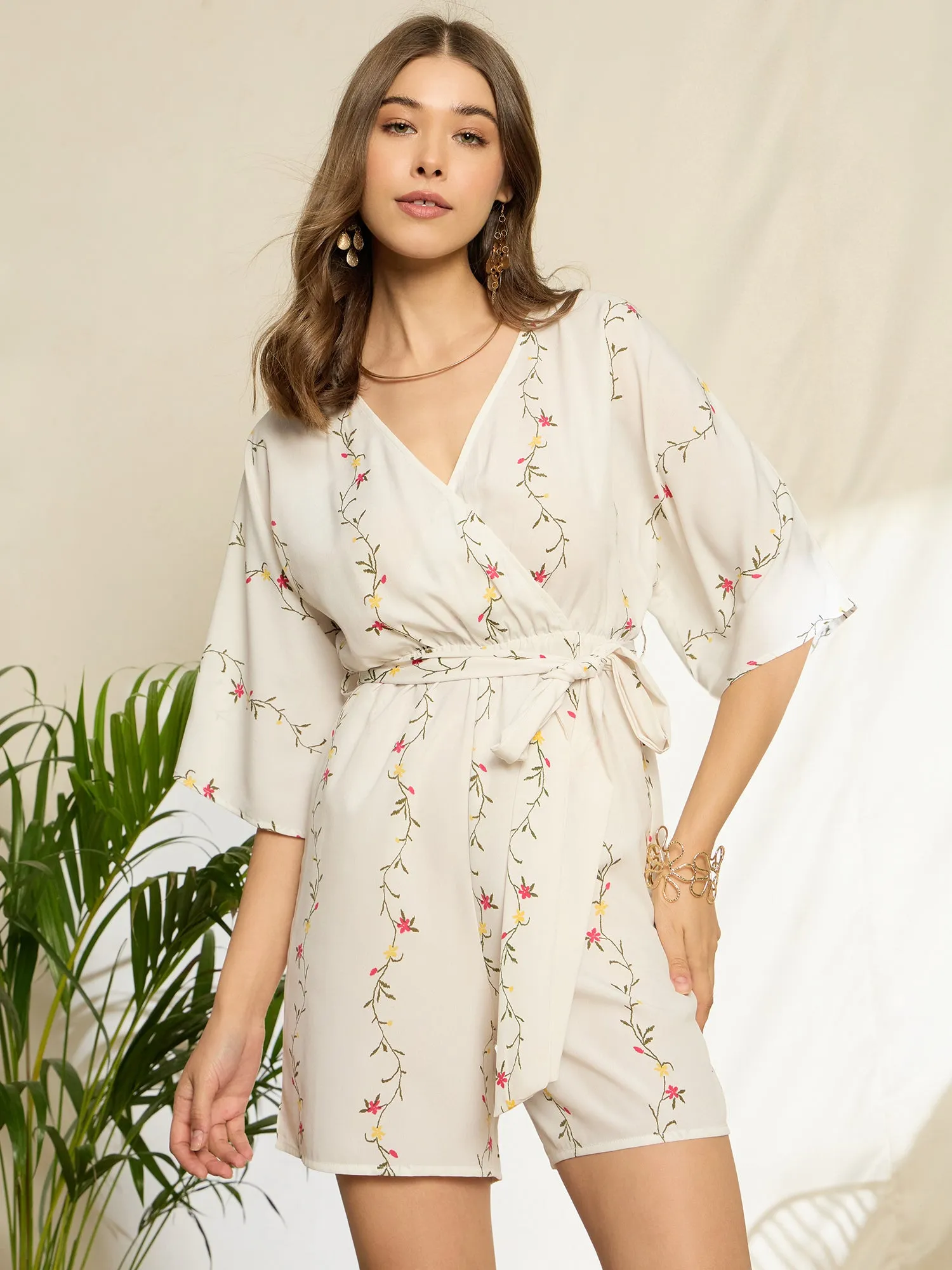 Berrylush Women White Floral Printed V-Neck Three-Quarter Sleeves Waist Tie-Up Wrap Mini Jumpsuit